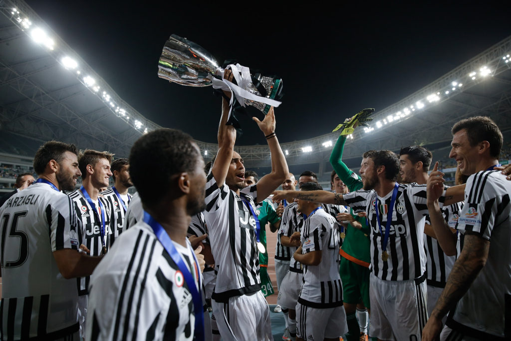 Martin Caceres (C) of Juventus celebrates with with teammates after winning the Italian Super Cup final football match