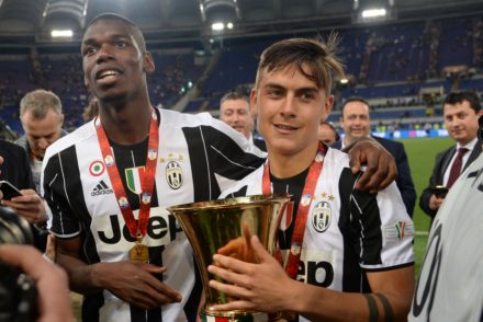 Argentina Paulo Dybala (R) and Juventus' midfielder from France Paul Pogba celebrate with the trophy after winning the Italian Tim Cup