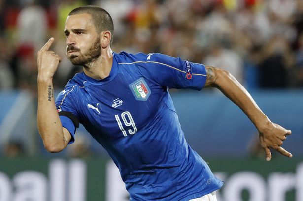 Italy's defender Leonardo Bonucci celebrates scoring a penalty shot