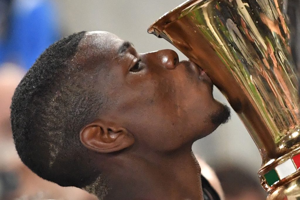 Paul Pogba kisses the trophy after winning the Italian Tim Cup final football match