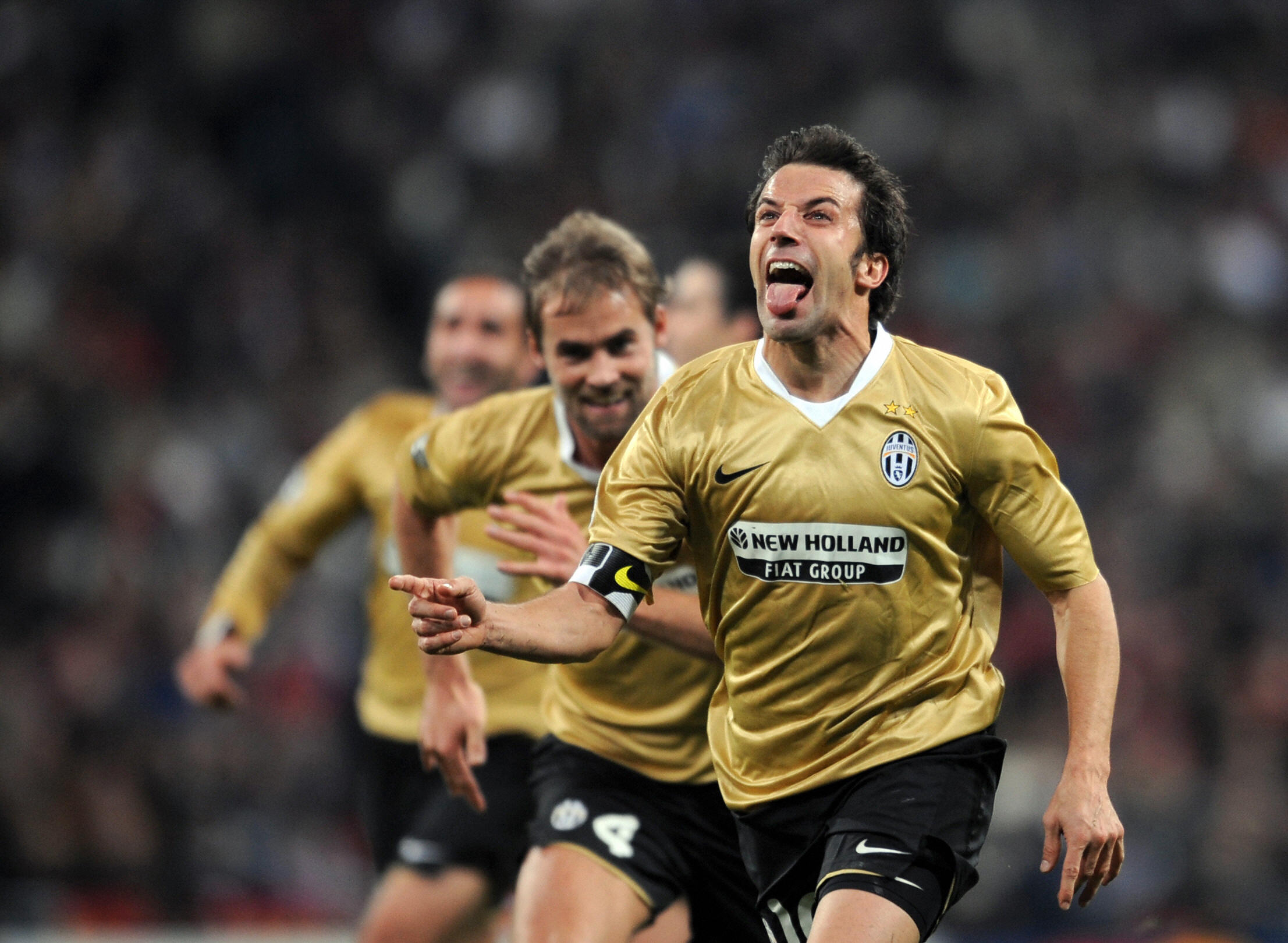 Juventus striker Alessandro Del Piero, center, followed by teammate Giorgio  Chiellini, left, with other teammates, warms-up next to an Italian Serie B  second division sign, at bottom, before the start of the