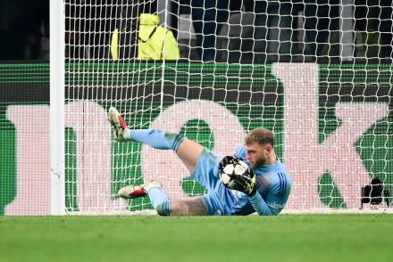 Michele Di Gregorio pulls off a save in the Champions League