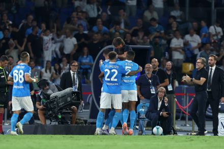 Lorenzo Lucca celebrates a goal with his Napoli teammates