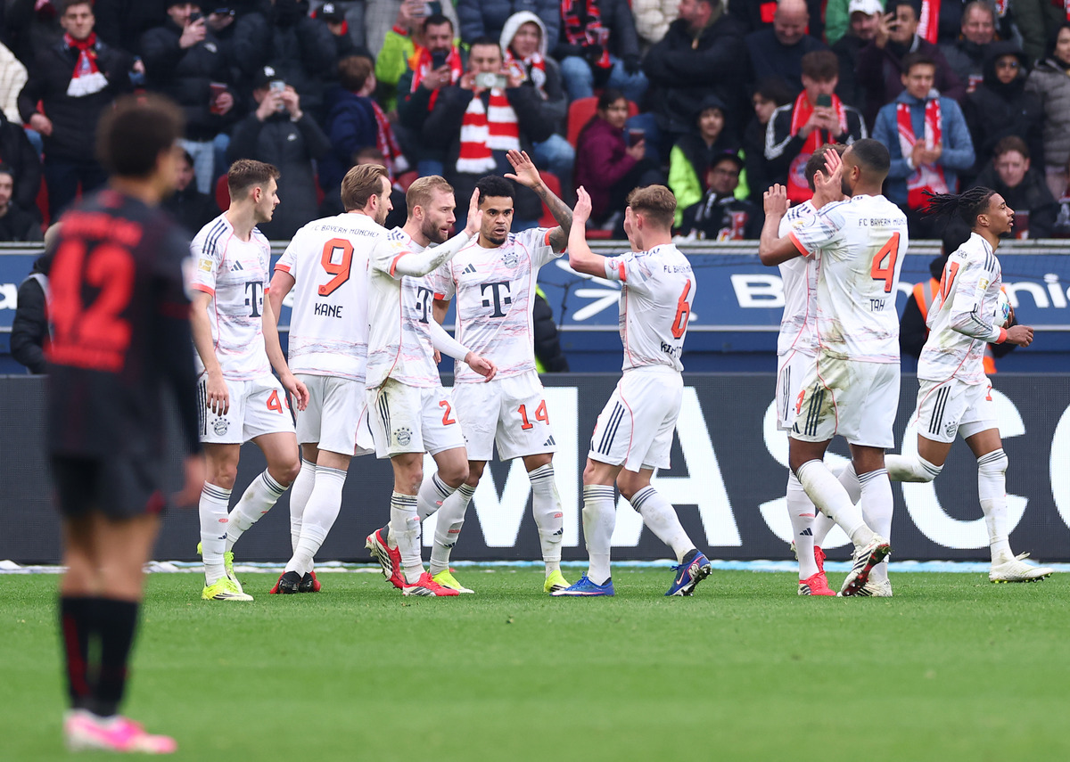 Bayern Munich players celebrate scoring against Bayer Leverkusen